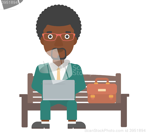 Image of Man working on laptop.