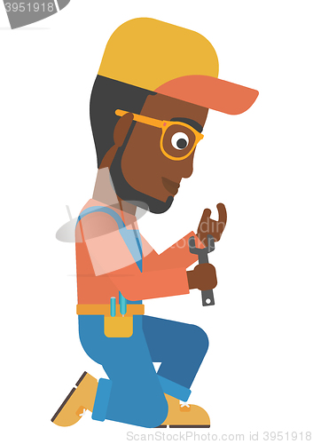Image of Repairman holding spanner.