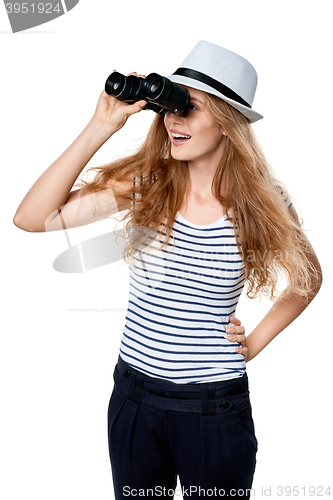 Image of Female looking through binoculars