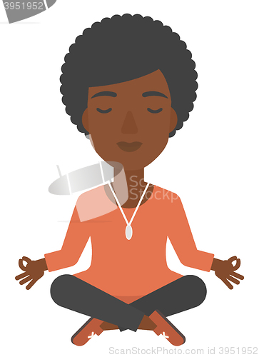 Image of Business woman meditating in lotus pose.