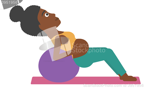 Image of Pregnant woman on gymnastic ball.