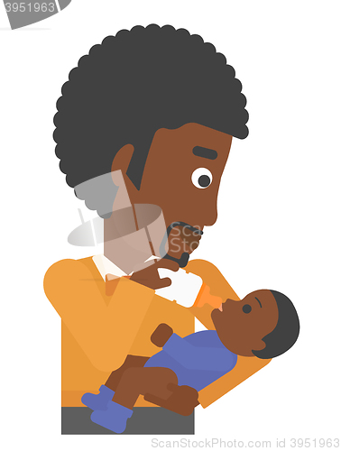 Image of Man feeding baby.