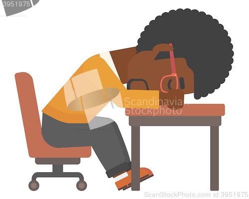 Image of Man sleeping on table.