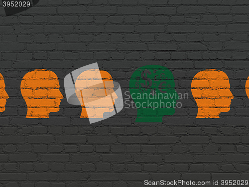 Image of Finance concept: head with finance symbol icon on wall background