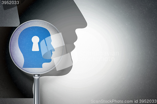 Image of Finance concept:  Head With Keyhole with optical glass on digital background