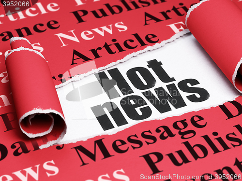 Image of News concept: black text Hot News under the piece of  torn paper