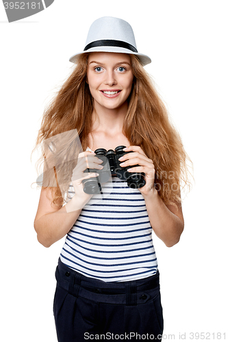 Image of Female looking through binoculars