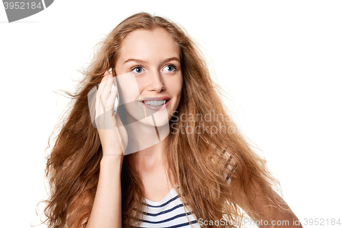 Image of Woman speaking on cell phone