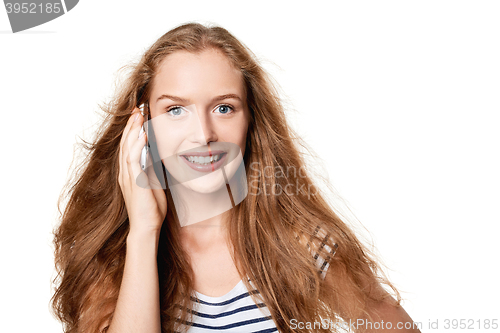 Image of Woman speaking on cell phone