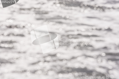 Image of Background - blurred sea surface water with the reflection of sunlight