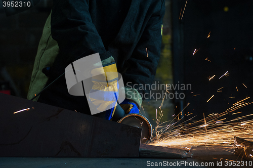 Image of worker welding metal