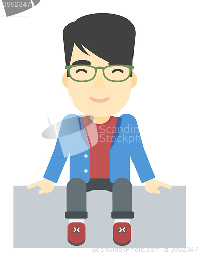 Image of Smiling man sitting.