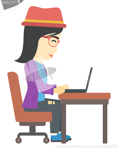 Image of Woman working at laptop.