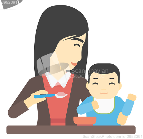 Image of Woman feeding baby.