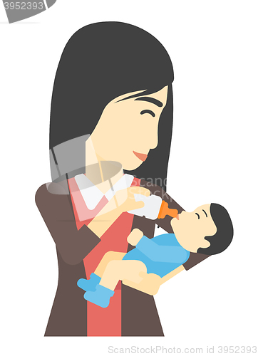 Image of Woman feeding baby.