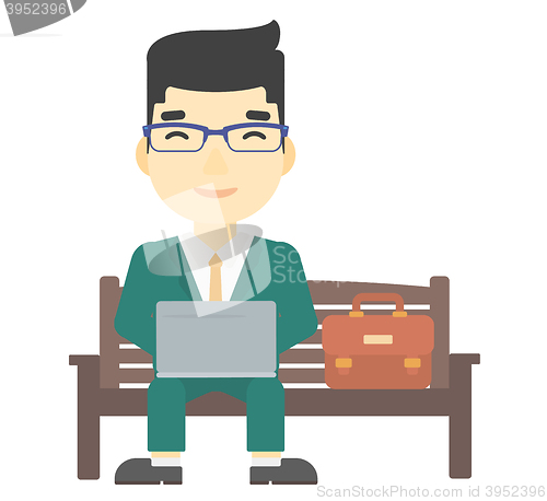 Image of Man working on laptop.