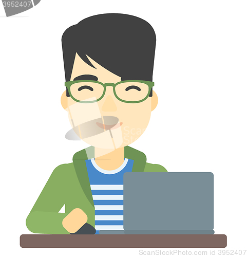 Image of Man working at laptop.