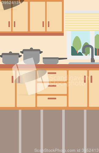 Image of Background of kitchen with kitchenware.