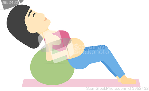 Image of Pregnant woman on gymnastic ball.