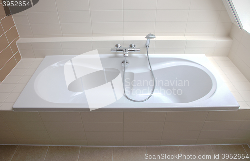 Image of Bathtub in a tiled bathroom