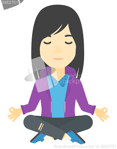 Image of Business woman meditating in lotus pose.