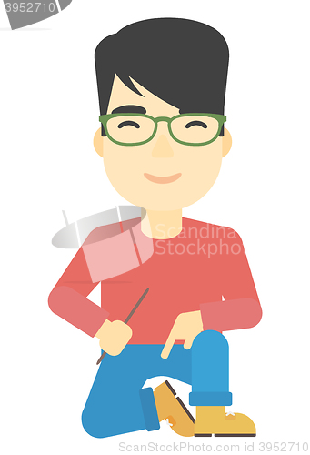 Image of Smiling man sitting.