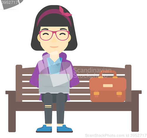Image of Woman working on laptop.