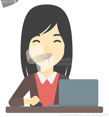 Image of Woman working at laptop.