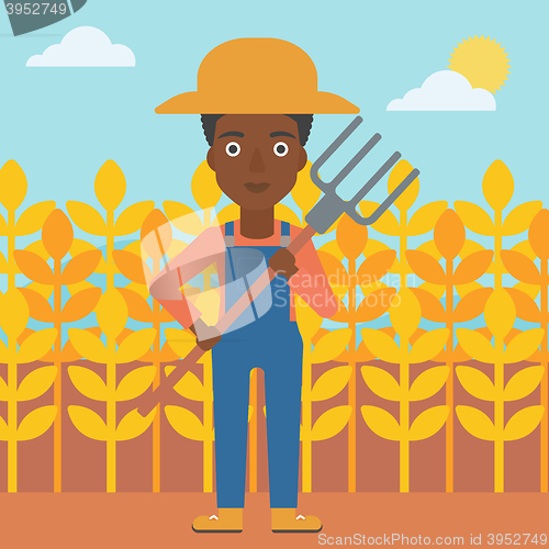 Image of Farmer with pitchfork.