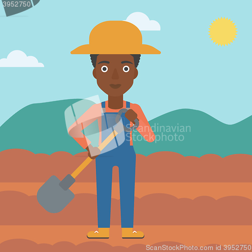 Image of Farmer on the field with shovel.