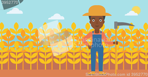 Image of Farmer on the field with scythe.