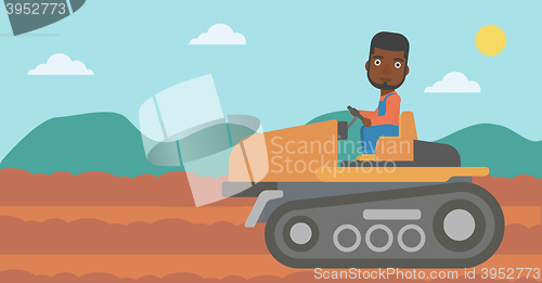 Image of Farmer driving tractor.