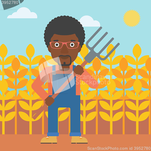 Image of Farmer with pitchfork.