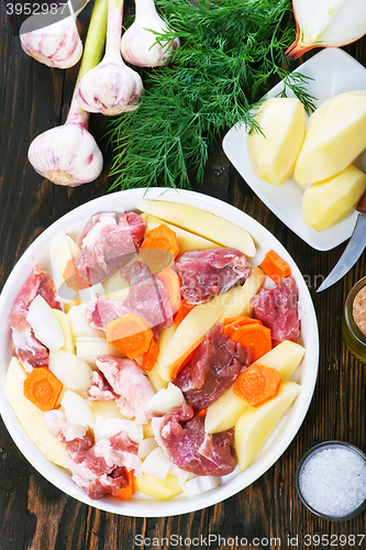 Image of raw meat with vegetables