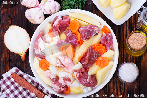 Image of raw meat with vegetables