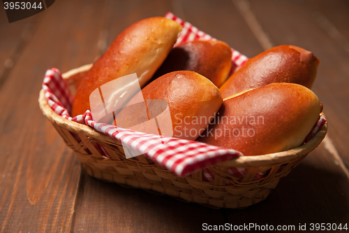 Image of Pies of puff pastry close up in a basket. 