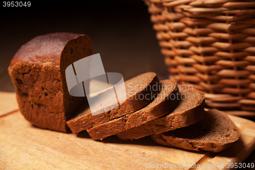 Image of Sliced rye bread and basket closeup