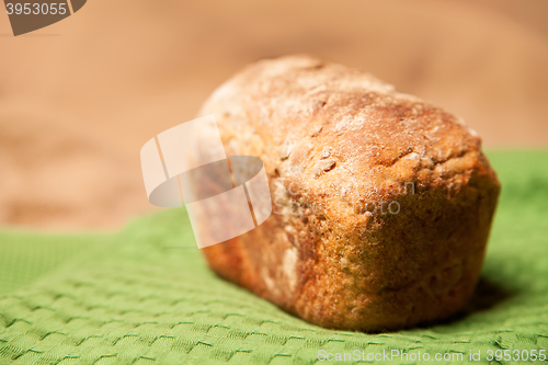 Image of Loaf of grey wheat rye bread on napkin