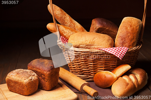 Image of Composition with bread, cutting board and rolling-pin