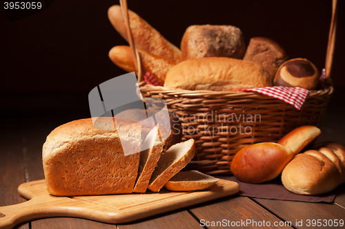 Image of Composition with bread and rolls in wicker basket