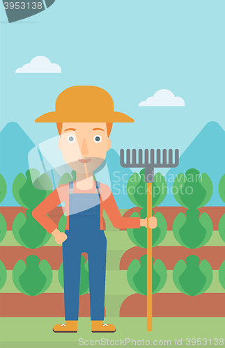 Image of Farmer with rake.