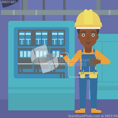 Image of Electrician with electrical equipment.