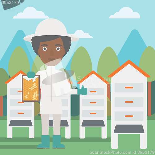 Image of Bee-keeper at apiary.