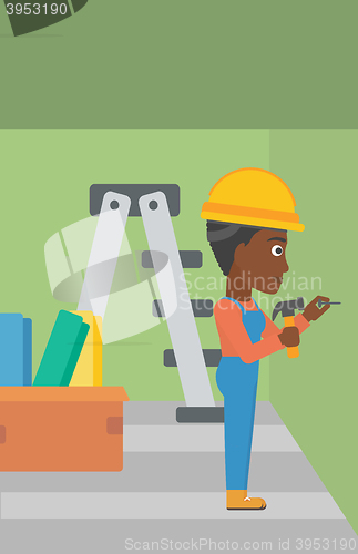 Image of Constructor hammering nail.