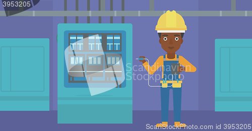 Image of Electrician with electrical equipment.