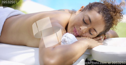 Image of Adult female resting on massage table