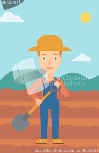 Image of Farmer on the field with shovel.