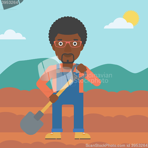 Image of Farmer on the field with shovel.