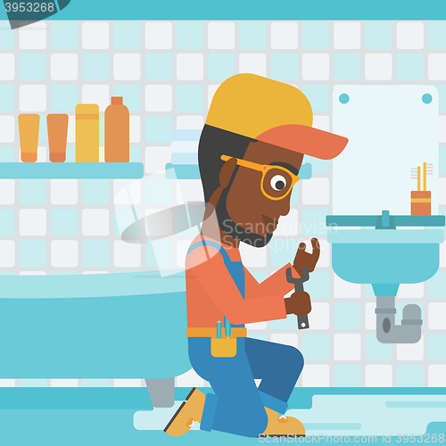 Image of Man repairing sink.