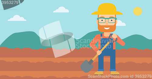 Image of Farmer on the field with shovel.